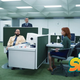 the cast of the show in the office.